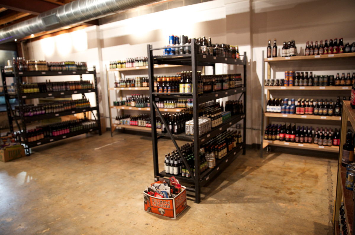 Bottle shelves behind the sample wall board